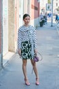 Woman with black and white polka dot shirt before Trussardi fashion show, Milan Fashion Week street style on