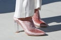 Woman with pink velvet high heel shoes with transparent heel before Alberto Zambelli fashion show, Milan