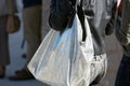 Woman with silver metallic bag and black leather jacket before Alberto Zambelli fashion show, Milan Fashion