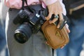 Woman with small beige Prada bag and Canon camera before Giorgio Armani fashion show, Milan Fashion Week