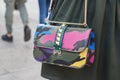 Woman with Valentino Garavani colorful camouflage bag before Cristiano Burani fashion show, Milan Fashion