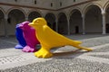 Milan Sforza Castle courtyard with three colorful birds