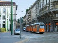 Milan street with orange tram Royalty Free Stock Photo