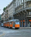 Milan street with orange tram Royalty Free Stock Photo