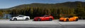 Miland, Norway. 04.06.2016: yellow Lamborghini Huracan, red Ferrari F12 and white Mclaren 650s