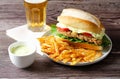 Milanesa sandwich with fries and beer