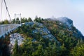 The Mile High Swinging Bridge and rocky summit in fog, at Grandfather Mountain, North Carolina. Royalty Free Stock Photo