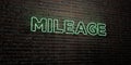 MILEAGE -Realistic Neon Sign on Brick Wall background - 3D rendered royalty free stock image Royalty Free Stock Photo