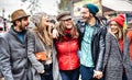 Milennial students group walking at europe city center - Next gen life style concept on multicultural young people wearing winter Royalty Free Stock Photo