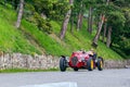 1000 Miles 2019, Brescia - Italy. May 15, 2019: The historic Mille Miglia car race. Two men rushing in a beautiful red vintage