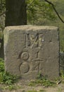 Milestone on canal towpath Royalty Free Stock Photo