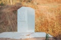 Milestone or Kilometer marker in Thailand..White milestone with grass roadside to Chiang Rai..Milestone on road concept. .Distance