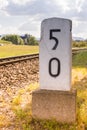 Milestone on a railway track Royalty Free Stock Photo