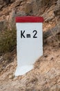 A milestone with second kilometer sign, spain Royalty Free Stock Photo