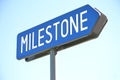 Milestone - blue signpost, sky