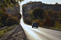 Landscape with autumn leaf color, and beautiful asphalt road in autumn. Highway in mountains