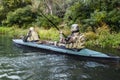 Militants in army kayak