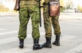 Militaries legs with security truncheons and officers bag.