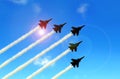 Military aerobatic jets under blue sky during Air Show