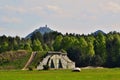 Military aircraft concrete shelter with castle on hill top in background