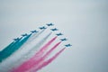 Military aircraft drawing an arrow Italian flag in the cloudy sky Royalty Free Stock Photo