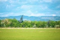 Military antennas camouflaged between trees on an air base, on a sunny summer day Royalty Free Stock Photo