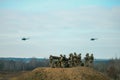 military army helicopters flying above military field Royalty Free Stock Photo