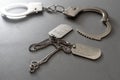 a military badge and handcuffs on a dark background