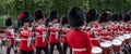 Military band belonging to the Irish Guards marches down The Mall during the Trooping the Colour military parade, London UK