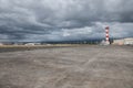 Military base airport runway with control tower.