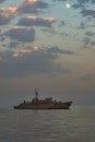 Military Battleships in a sea bay at sunset time