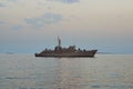 Military Battleships in a sea bay at sunset time