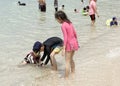 Military Beach.People sunbathe and swim.Some vacationers stroll