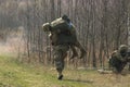 Military bear at back his wounded friend