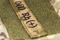 Military blood type sticker on a camouflage uniform
