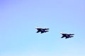 Aviation pilots demonstrate high aerobatics on fighters. Aircraft bombers in the blue sky. Military aircraft in the sky Royalty Free Stock Photo