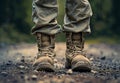 Military boots on the ground. A soldier& x27;s boots with kid& x27;s feet Royalty Free Stock Photo