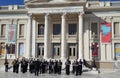 Military brass band playing music in front of the building of Municipal Theatre Of Piraeus