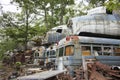 Military buses and aircraft in junkyard Royalty Free Stock Photo