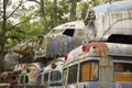 Military buses piled with aircraft in junkyard Royalty Free Stock Photo