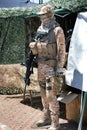 Military camouflage equipment with weapons