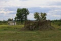 Military camouflaged dugout leading to an underground bunker