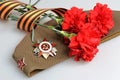 Military cap, order of Great Patriotic war, flower Royalty Free Stock Photo