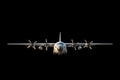 Military cargo aircraft on black background. Royalty Free Stock Photo