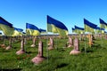 Military cemetery where soldiers who died in Russian war against Ukraine are buried. State Ukrainian flag flutter over graves and