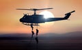 Military commandos helicopter drops during sunrise