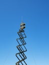 Military communications antenna against the sky. Royalty Free Stock Photo