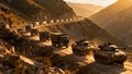 Military Convoy Vehicles Moving Through Mountain Pass Deployment Royalty Free Stock Photo