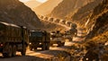 Military Convoy Vehicles Moving Through Mountain Pass Deployment Royalty Free Stock Photo