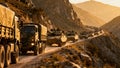 Military Convoy Vehicles Moving Through Mountain Pass Deployment Royalty Free Stock Photo